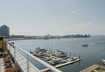 the view of the harbor from the deck of a marina with boats docked at Tindeco Wharf, Baltimore, MD